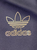 CHAQUETA ADIDAS x SHELL NEGRA Y DORADA TALLA S