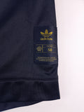 CHAQUETA ADIDAS x SHELL NEGRA Y DORADA TALLA S