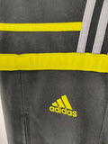 Pantalón Adidas Challenger - negro franjas blancas y amarillas - Talla M/L